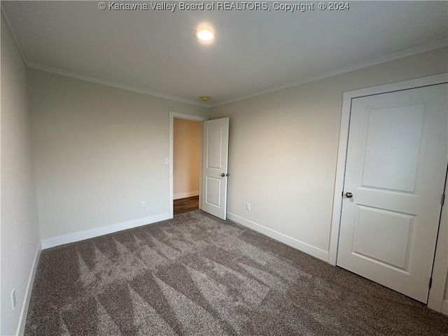 interior space with carpet flooring and crown molding