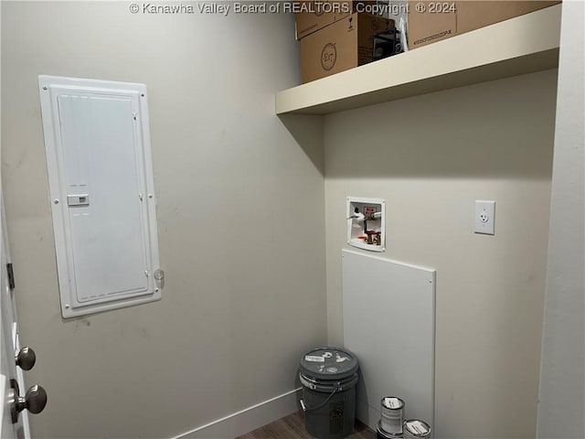 washroom featuring washer hookup, wood-type flooring, and electric panel