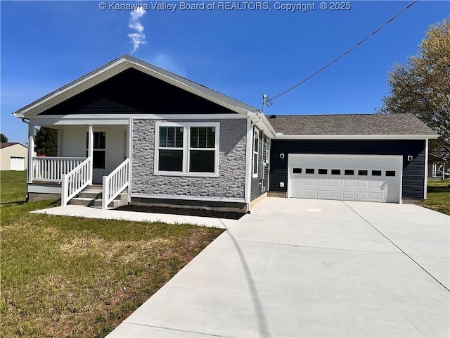 single story home with an attached garage, driveway, a front yard, and covered porch