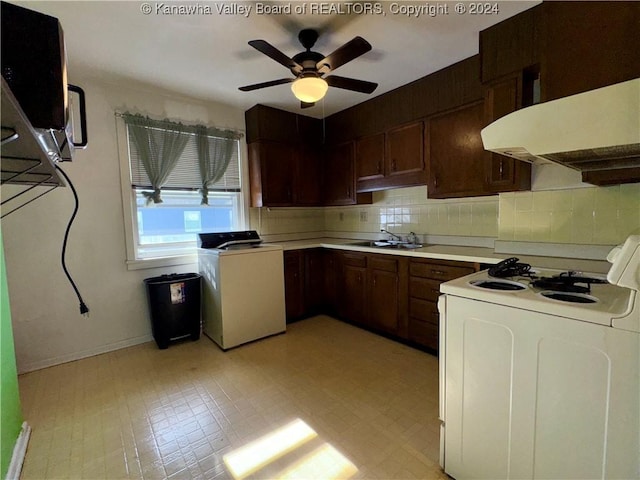 kitchen with ceiling fan, sink, range hood, washer / dryer, and white stove