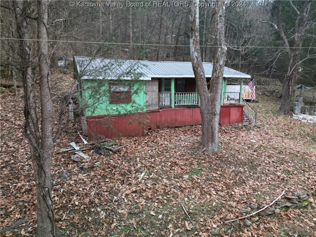 view of side of home featuring a porch