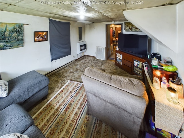 carpeted living room with heating unit and a baseboard radiator