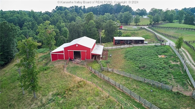 birds eye view of property featuring a rural view