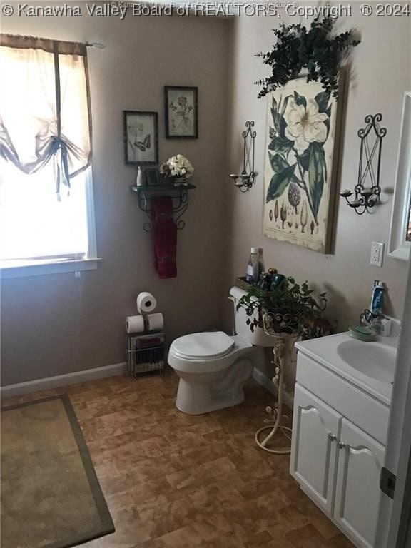 bathroom with vanity and toilet