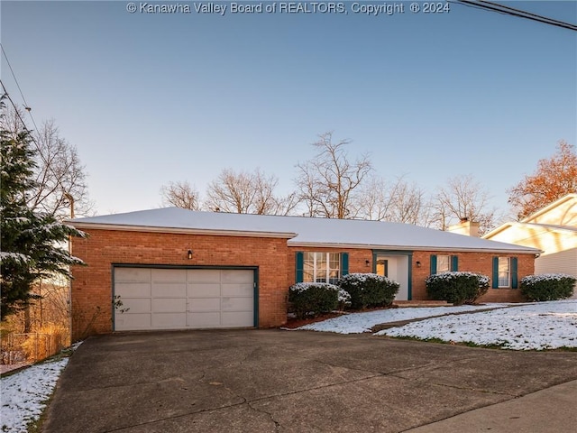 single story home featuring a garage