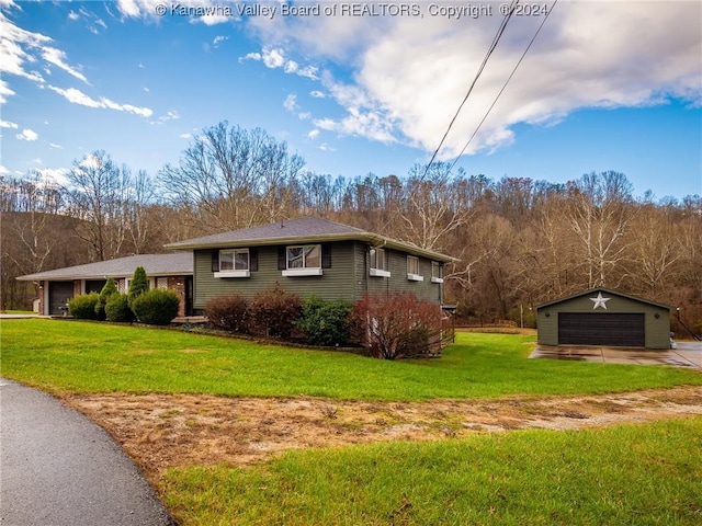 view of side of property featuring an outbuilding, a yard, and a garage