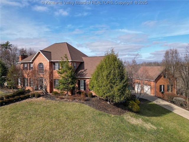 view of front of house with a garage and a front lawn