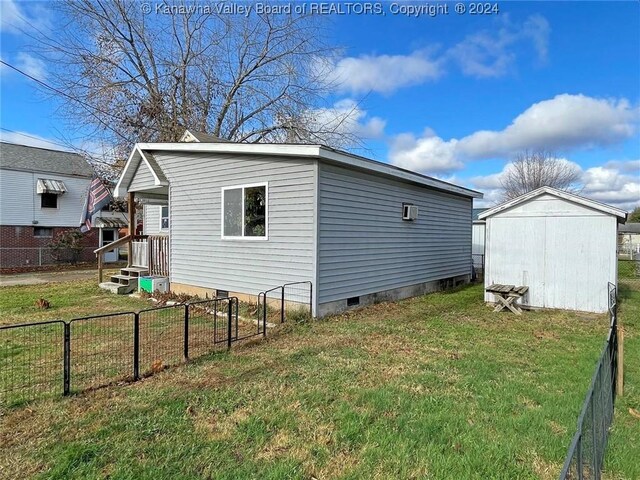 view of home's exterior with a yard