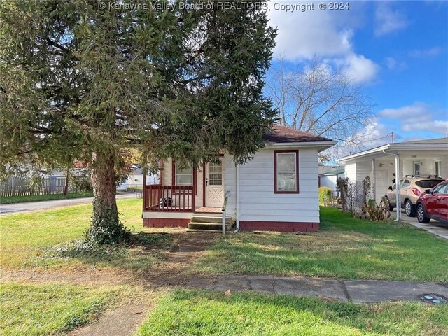 view of front of house with a porch and a front yard