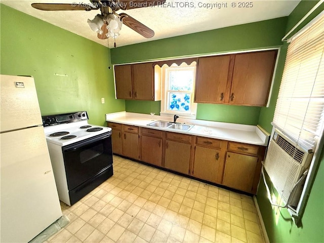 kitchen featuring range with electric cooktop, ceiling fan, sink, and white fridge