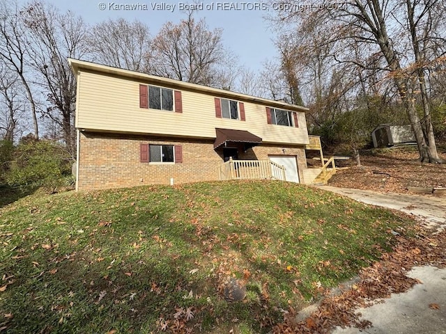 view of front facade with a front yard and a garage