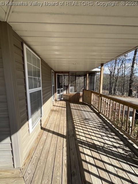 wooden terrace with a porch