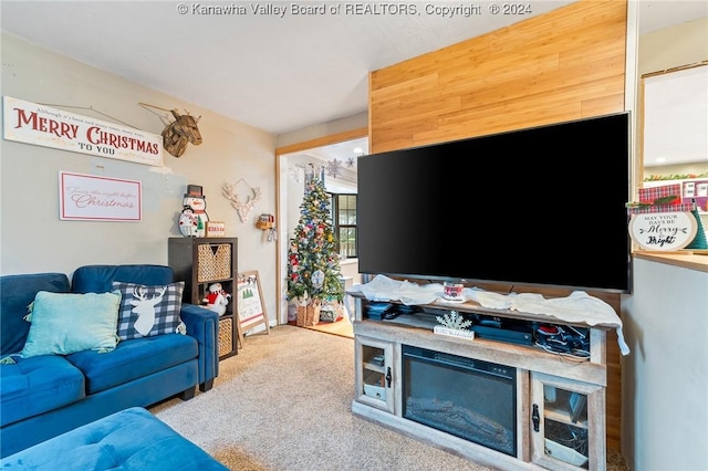 carpeted living room with a fireplace