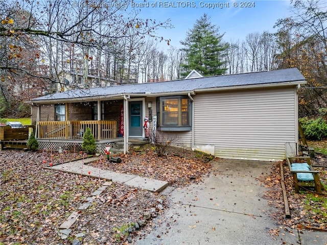 ranch-style home with covered porch