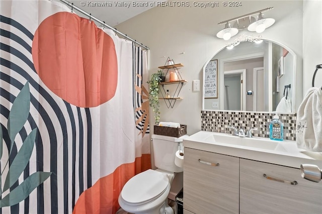 bathroom with decorative backsplash, vanity, toilet, and a shower with shower curtain