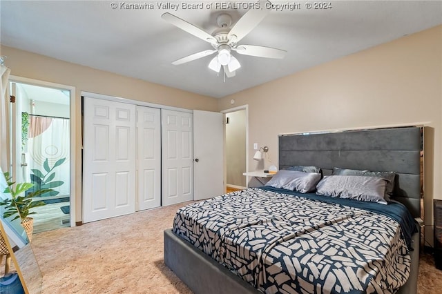 carpeted bedroom featuring a closet and ceiling fan