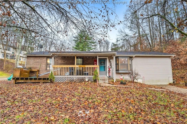 single story home featuring a porch