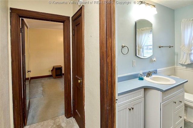 bathroom featuring vanity and toilet