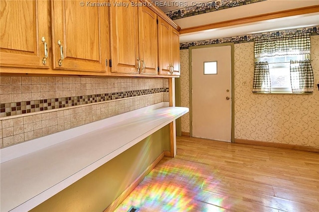 interior space featuring light wood-type flooring and a healthy amount of sunlight