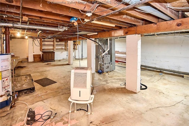 basement featuring gas water heater and heating unit