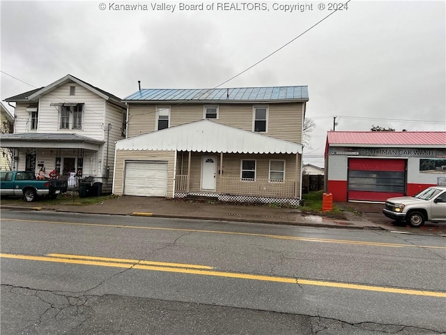 view of front of property with a garage