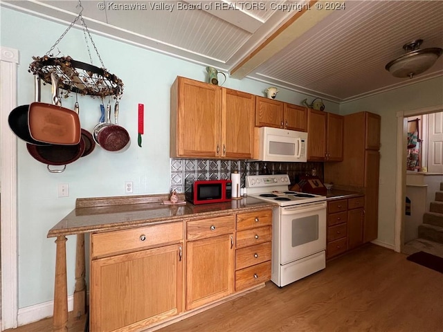 kitchen with decorative backsplash, light wood-type flooring, white appliances, and ornamental molding