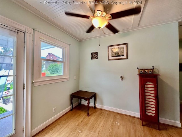 entryway with ceiling fan, ornamental molding, and light wood-type flooring