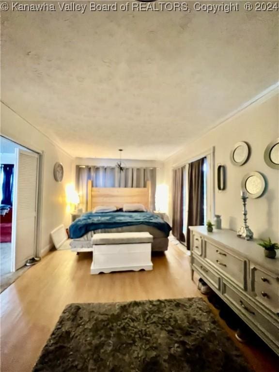 bedroom with light wood-type flooring