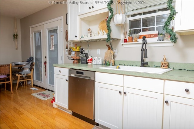 kitchen featuring dishwasher, light hardwood / wood-style floors, white cabinetry, and sink