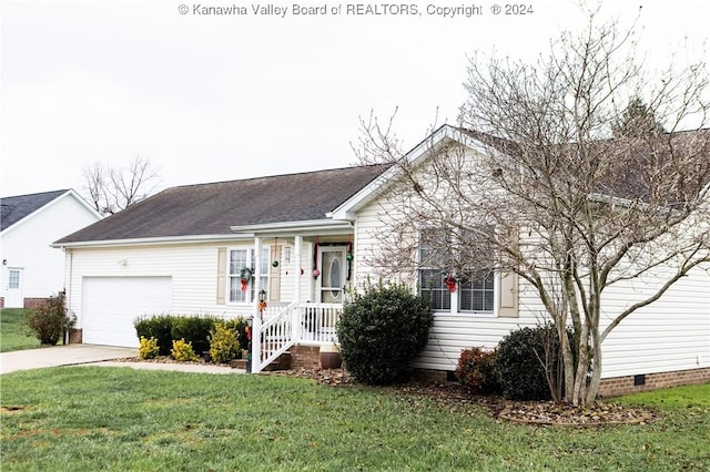 ranch-style home with a garage and a front lawn