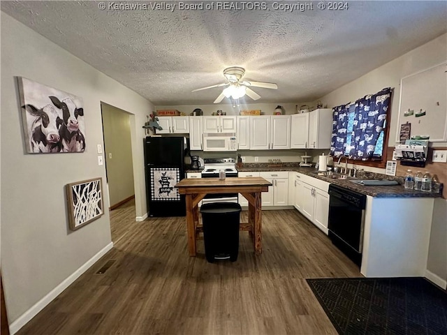 kitchen with sink, dark hardwood / wood-style floors, a textured ceiling, white cabinets, and black appliances