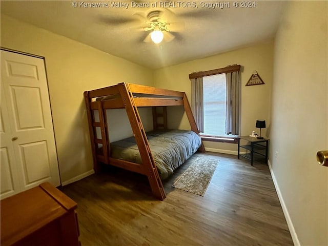 bedroom with ceiling fan and dark wood-type flooring