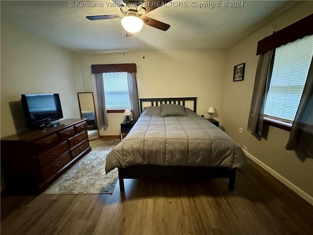 bedroom with hardwood / wood-style floors and ceiling fan
