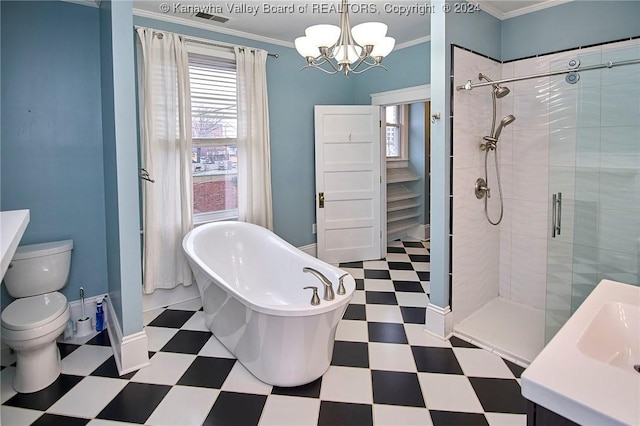 bathroom featuring tile patterned floors, a soaking tub, an inviting chandelier, and ornamental molding