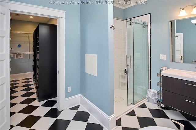 bathroom with tile patterned floors, baseboards, ornamental molding, and a shower stall