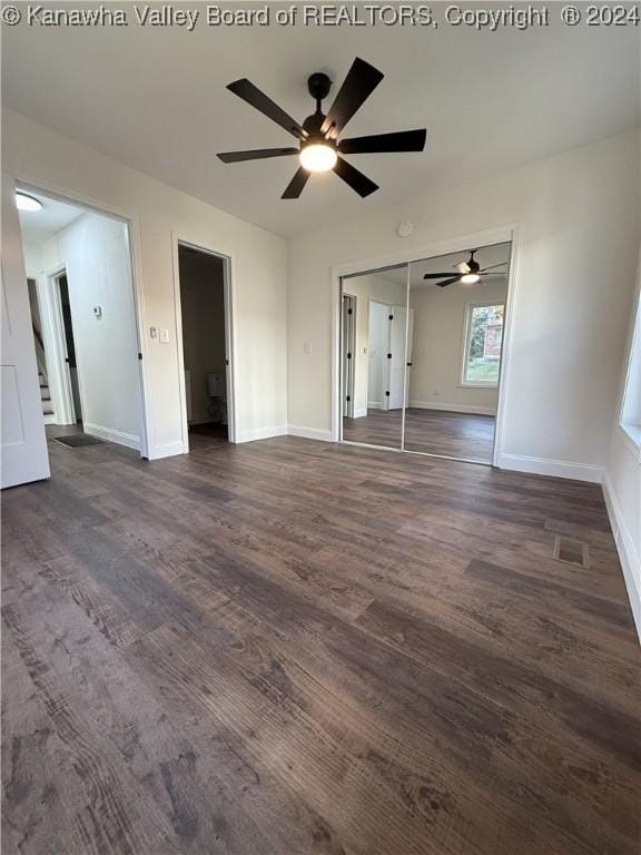 unfurnished room with ceiling fan and dark hardwood / wood-style floors