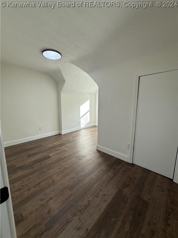 empty room featuring dark hardwood / wood-style flooring