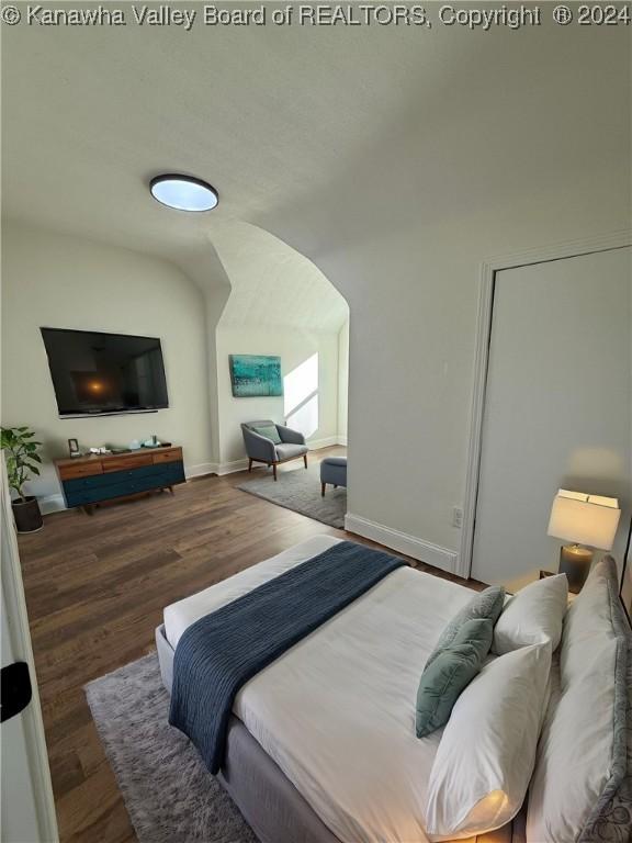 bedroom featuring dark hardwood / wood-style flooring