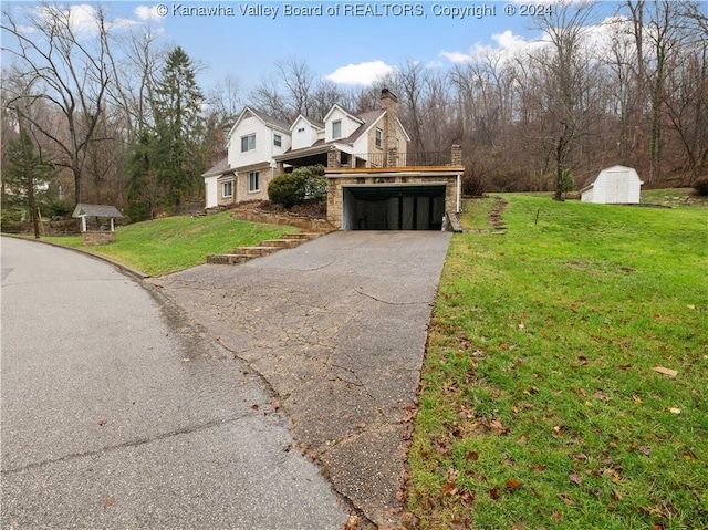 view of side of home with a lawn and a storage shed