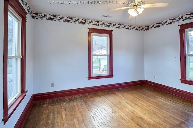 unfurnished room featuring ceiling fan and wood-type flooring