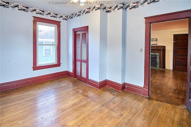 unfurnished room featuring wood-type flooring