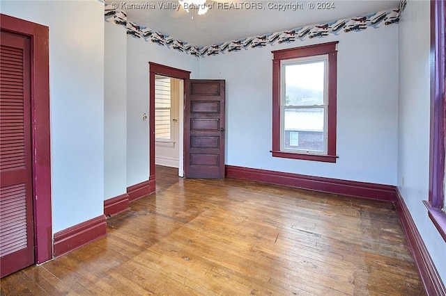 empty room featuring hardwood / wood-style flooring