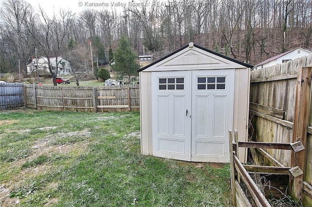 view of outbuilding with a yard