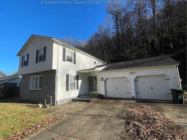 front of property with a garage