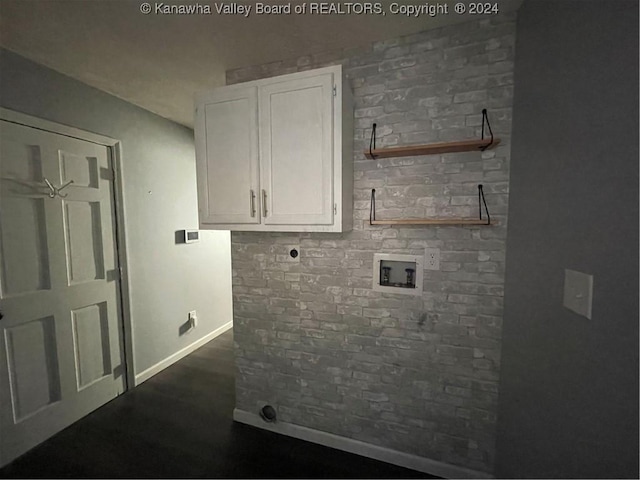 laundry room featuring hookup for an electric dryer and cabinets