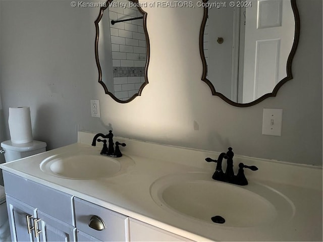 bathroom featuring vanity and toilet