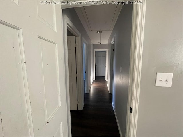 hall with dark hardwood / wood-style floors