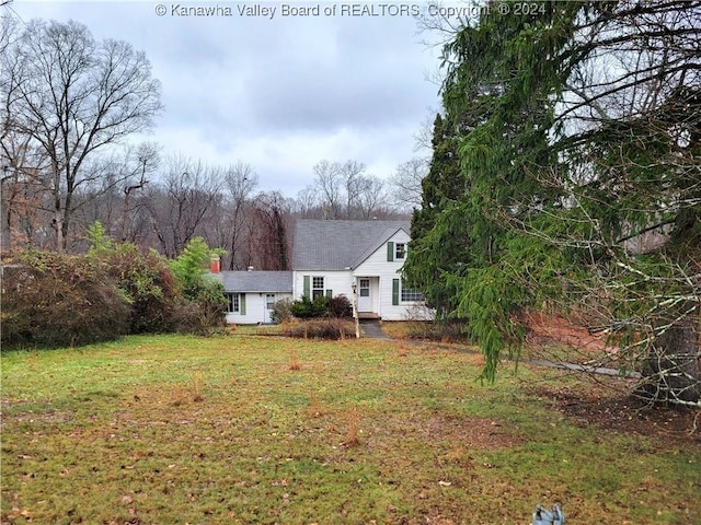 back of house with a yard