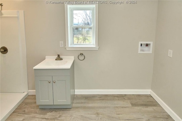 bathroom with vanity and wood-type flooring