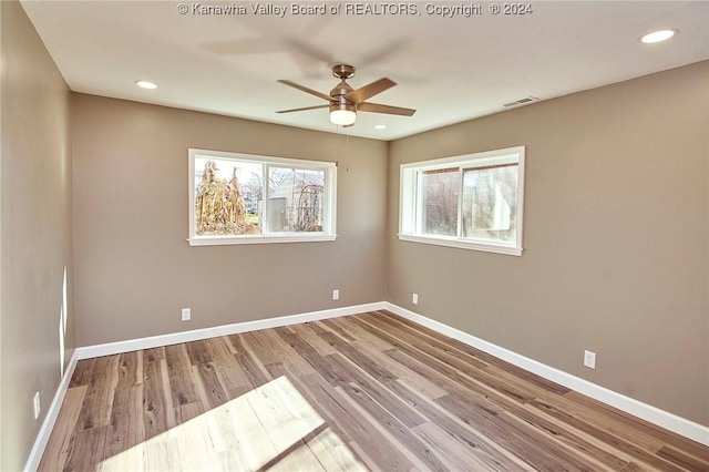 unfurnished room featuring light hardwood / wood-style floors and ceiling fan